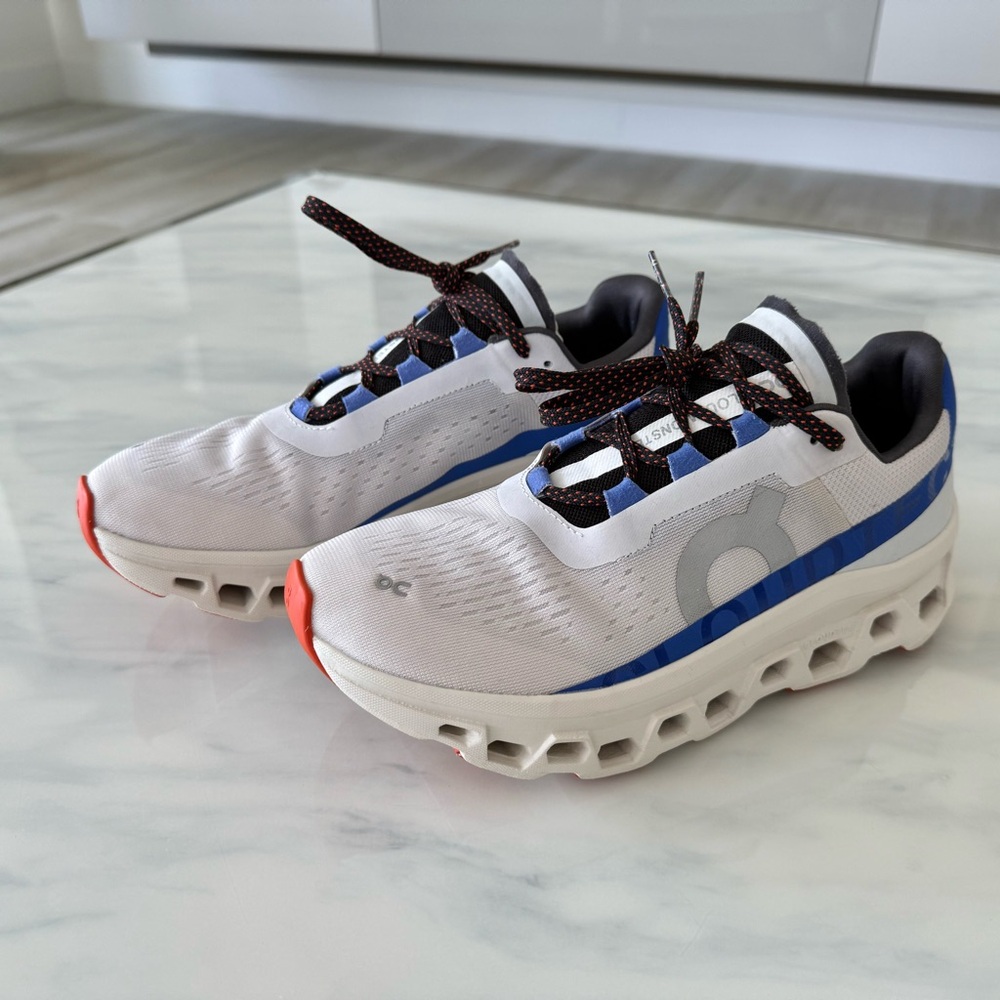 On Running White and Blue Athletic Shoes with Ventilated Sole